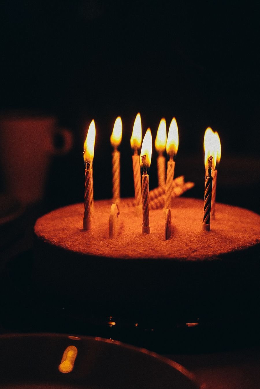 Birthday cake with lit candles